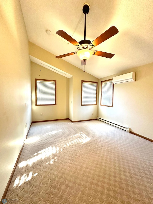 carpeted empty room featuring lofted ceiling, a wall mounted air conditioner, a baseboard radiator, and ceiling fan