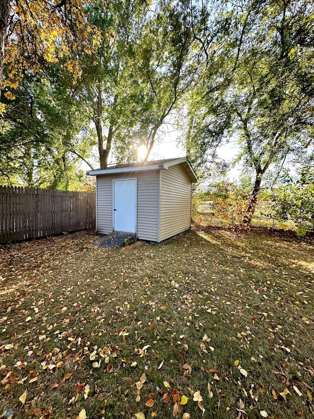 view of outbuilding with a lawn