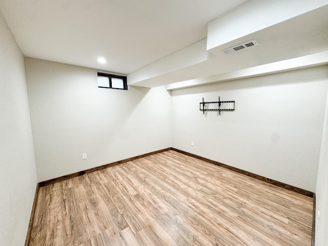 basement featuring wood-type flooring