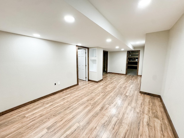 basement featuring light wood-type flooring