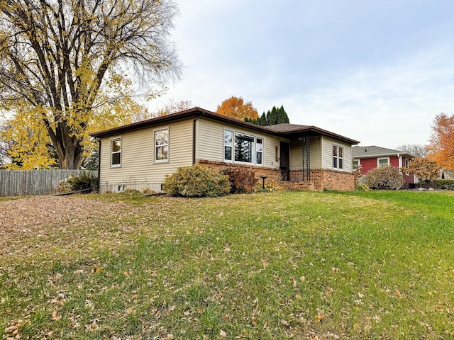 ranch-style house with a front yard