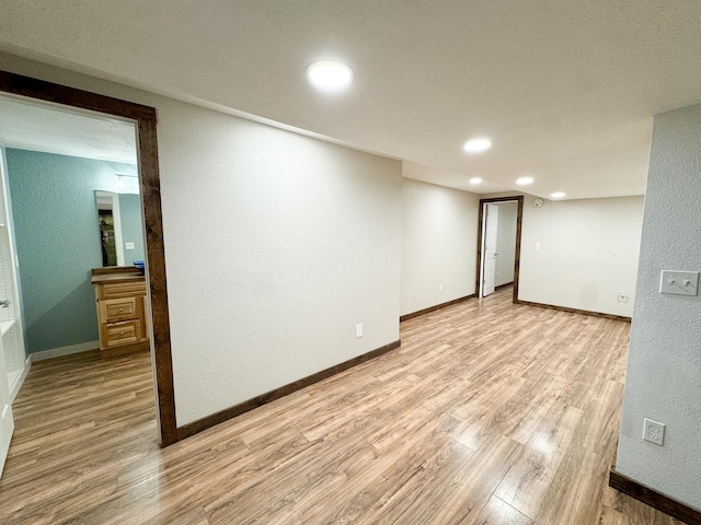 basement featuring light hardwood / wood-style flooring