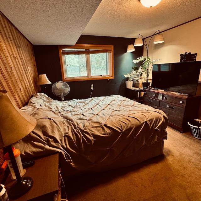 carpeted bedroom featuring a textured ceiling