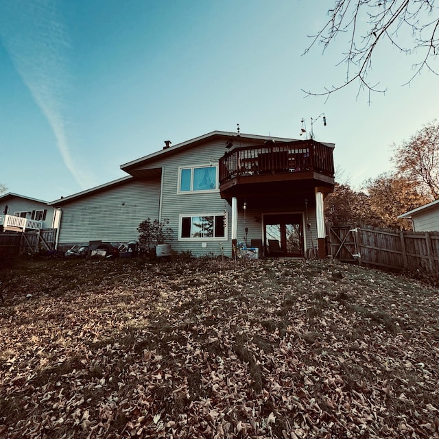 rear view of property with a wooden deck