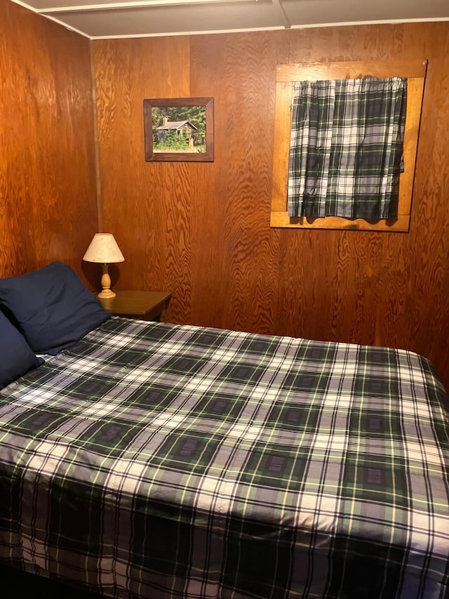 bedroom with wooden walls