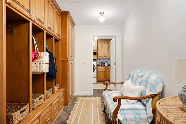 mudroom with washer / dryer and baseboards