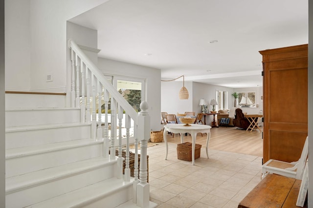 interior space featuring a healthy amount of sunlight and stairway