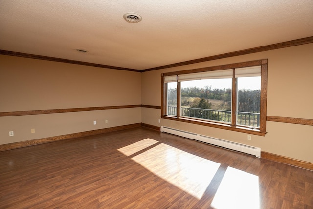 2700 115th St NW, Oronoco, MN 55960 - empty room with baseboard heating, dark wood finished floors, baseboards, visible vents, and ornamental molding