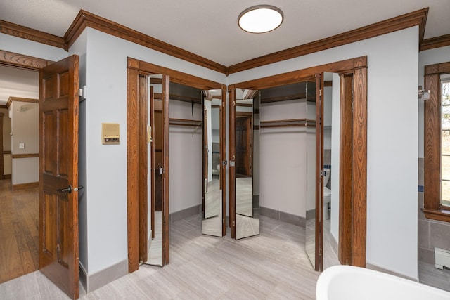 2700 115th St NW, Oronoco, MN 55960 - unfurnished bedroom with crown molding, baseboards, and wood finished floors