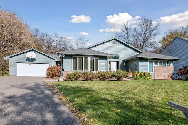 ranch-style home with a front yard and a garage