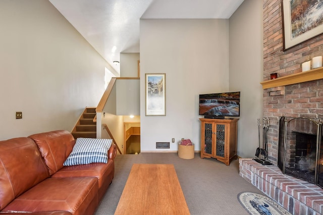 living room with carpet flooring and a brick fireplace