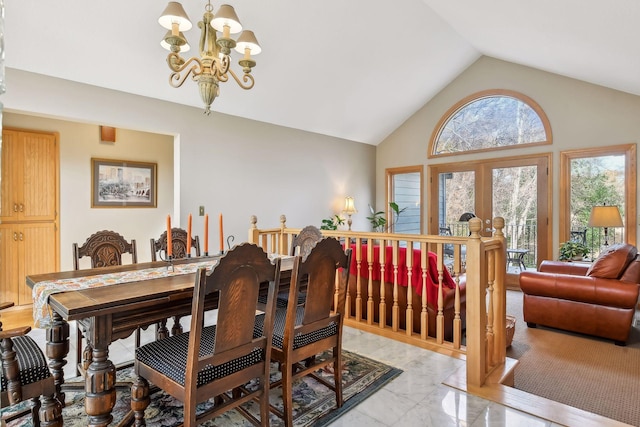 dining area featuring vaulted ceiling and a notable chandelier