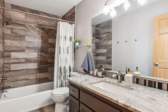 full bathroom with shower / bath combination with curtain, vanity, and toilet