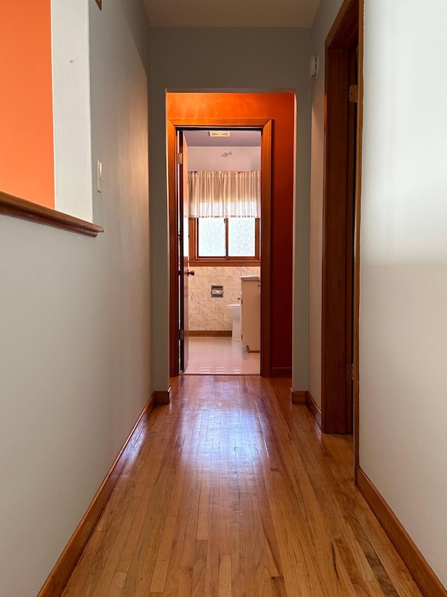 hall with light hardwood / wood-style flooring