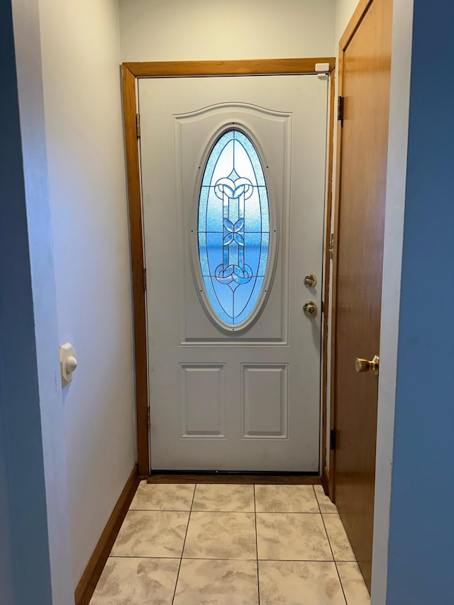 entryway featuring light tile patterned flooring