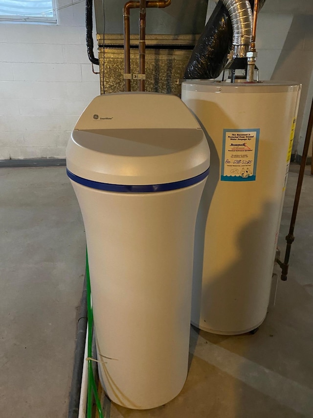 utility room with gas water heater