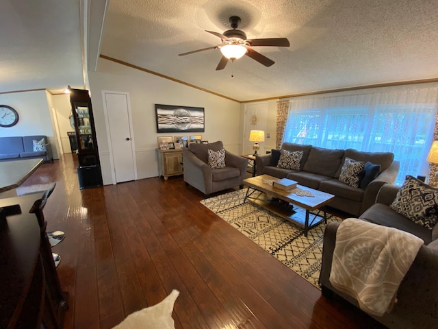 living room featuring vaulted ceiling with beams, a textured ceiling, dark wood-type flooring, and ceiling fan