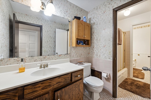 full bathroom with toilet, shower / bath combination, tile patterned flooring, vanity, and a textured ceiling