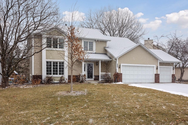 front facade featuring a front lawn and a garage