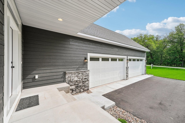 garage featuring a lawn