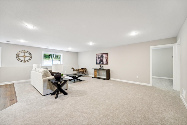 living room featuring light carpet