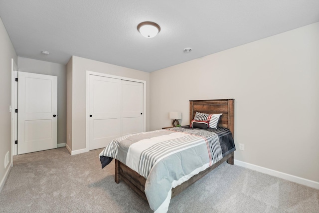 carpeted bedroom featuring a closet