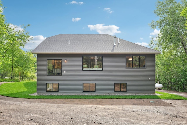 back of house featuring a yard