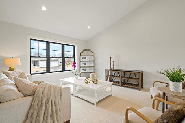 living room featuring light carpet and lofted ceiling