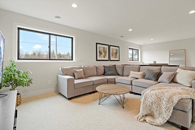 carpeted living room with a healthy amount of sunlight