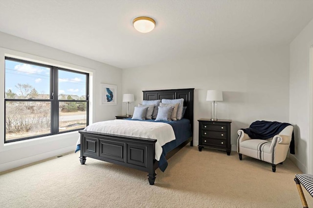 bedroom with light colored carpet