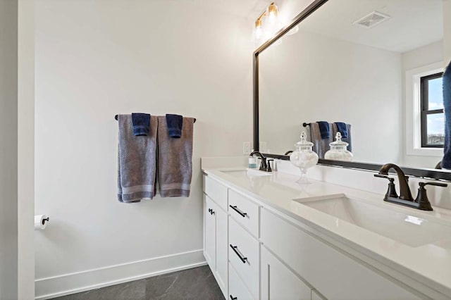 bathroom featuring tile patterned floors and vanity