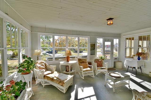 sunroom featuring a healthy amount of sunlight and wood finished floors