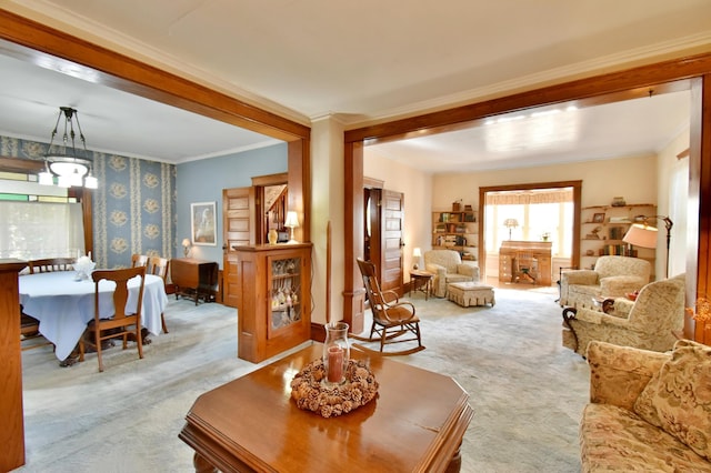 carpeted living room featuring crown molding