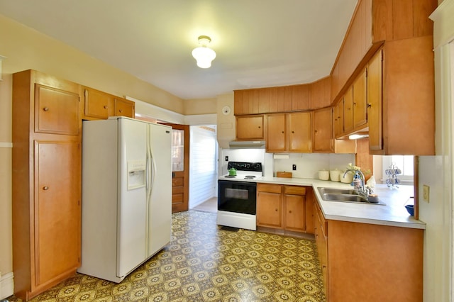 kitchen with range with electric cooktop, white refrigerator with ice dispenser, a sink, light countertops, and under cabinet range hood