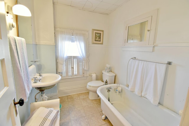 bathroom featuring a bathing tub and toilet