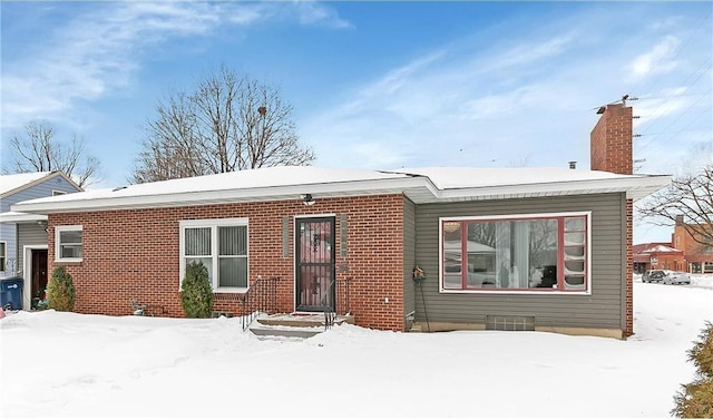 view of snow covered property