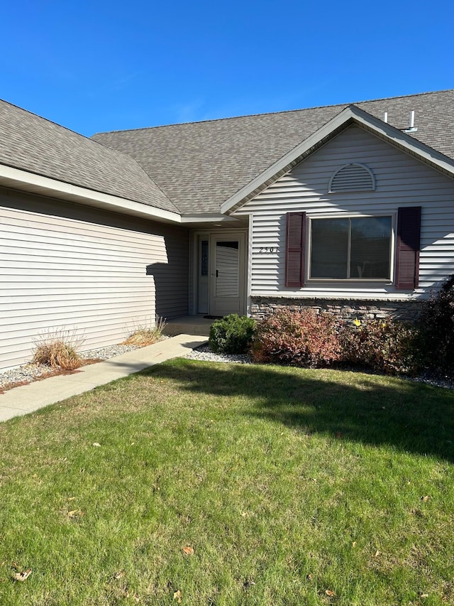 2501 Le Homme Dieu Vw NE, Alexandria, MN 56308 - property entrance featuring a lawn and a shingled roof