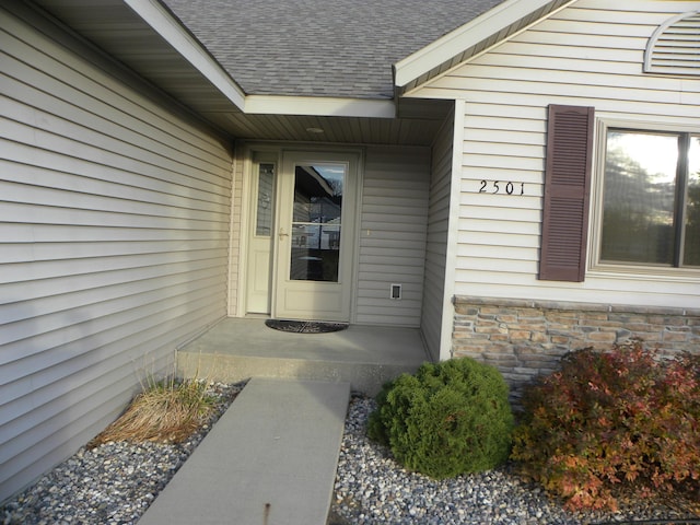 2501 Le Homme Dieu Vw NE, Alexandria, MN 56308 - doorway to property with a shingled roof and stone siding