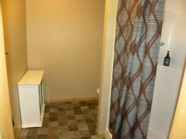 2501 Le Homme Dieu Vw NE, Alexandria, MN 56308 - full bathroom featuring toilet, curtained shower, and baseboards