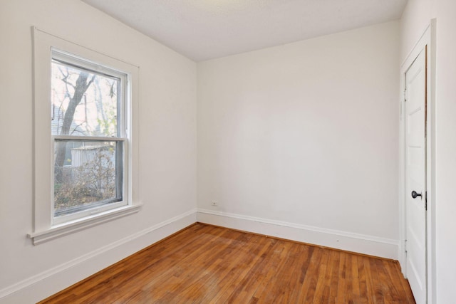 spare room featuring hardwood / wood-style floors