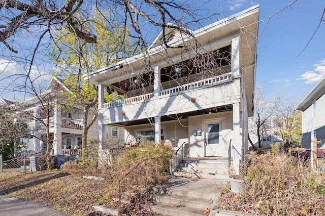 view of front of property with a balcony