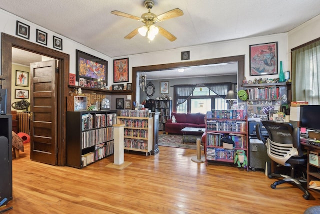 office area featuring ceiling fan, hardwood / wood-style floors, and a textured ceiling