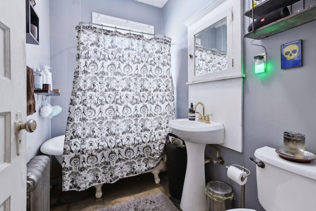 bathroom with a shower with curtain, radiator heating unit, and toilet