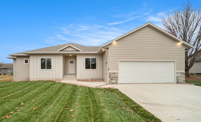 ranch-style house with a front yard and a garage