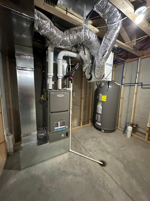 utility room featuring electric water heater