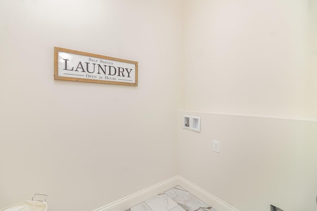 clothes washing area featuring washer hookup