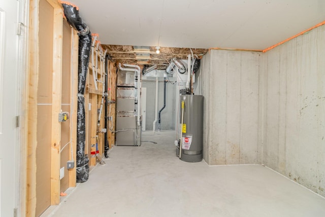 basement featuring gas water heater and heating unit