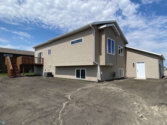 1312 Southview Dr SW, Glyndon, MN 56547 - back of house with a deck, stairs, and central AC