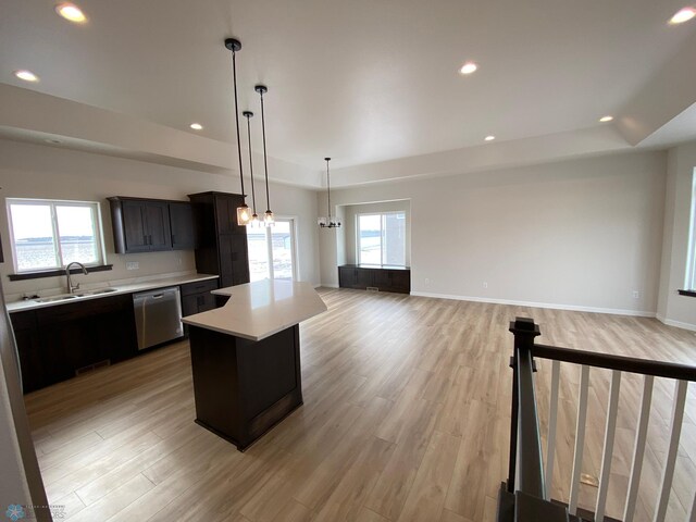 1312 Southview Dr SW, Glyndon, MN 56547 - kitchen featuring dishwasher, light countertops, a chandelier, a kitchen island, and a sink