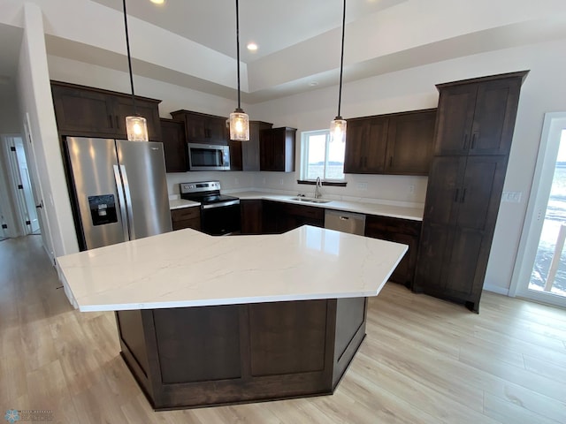 1312 Southview Dr SW, Glyndon, MN 56547 - kitchen featuring appliances with stainless steel finishes, dark brown cabinets, light wood-type flooring, recessed lighting, and a sink